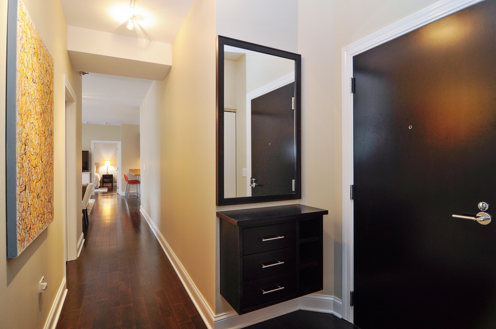 2 West Delaware Place, Unit 504 Chicago, IL 60610 - Photo 2 of 24 a view of a hallway with a livingroom and furniture