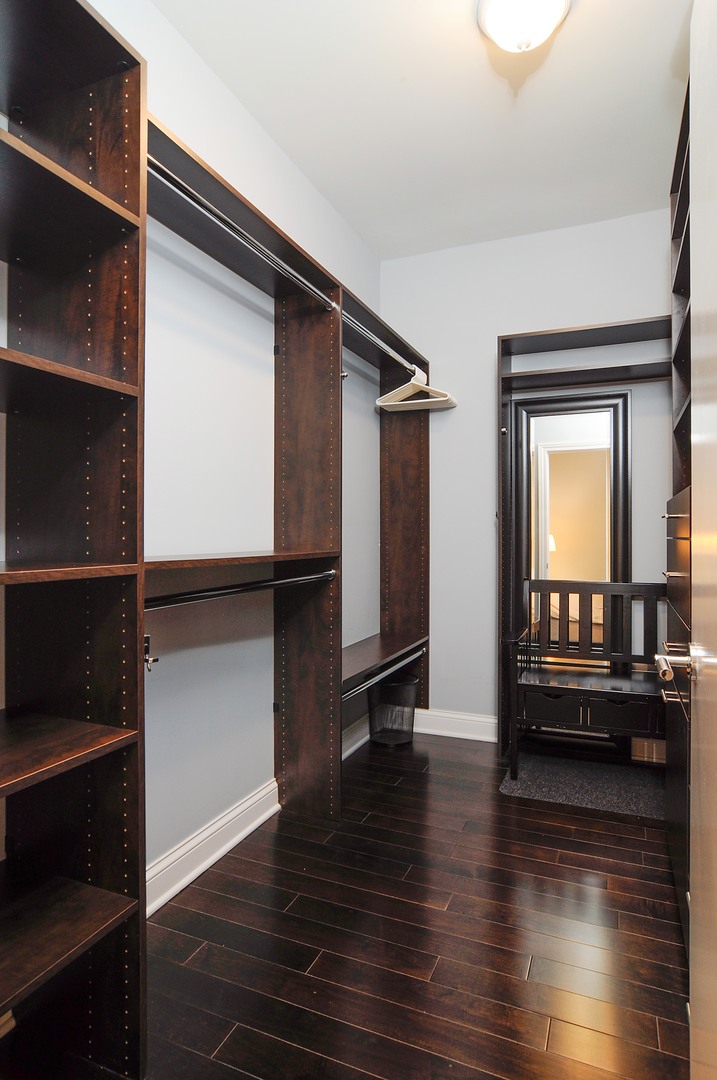 2 West Delaware Place, Unit 504 Chicago, IL 60610 - Photo 11 of 24 a view of a hallway with wooden floor and closet