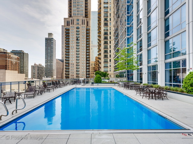2 West Delaware Place, Unit 504 Chicago, IL 60610 - Photo 17 of 24 a swimming pool with outdoor seating and yard