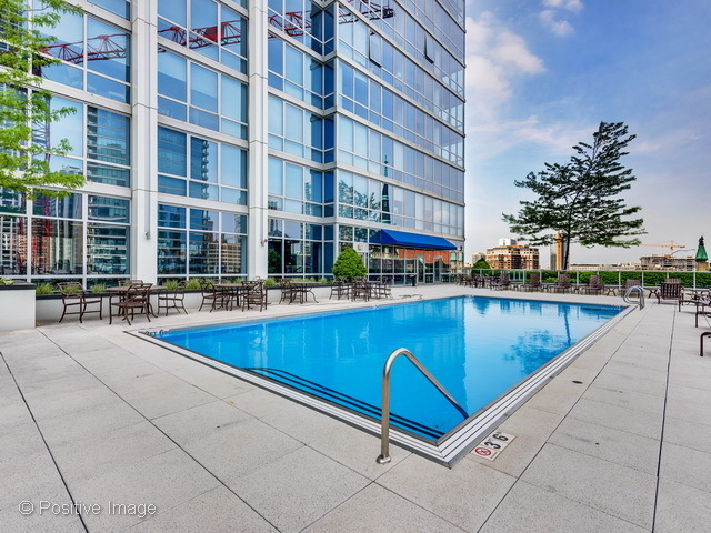 2 West Delaware Place, Unit 504 Chicago, IL 60610 - Photo 18 of 24 a view of swimming pool with chairs