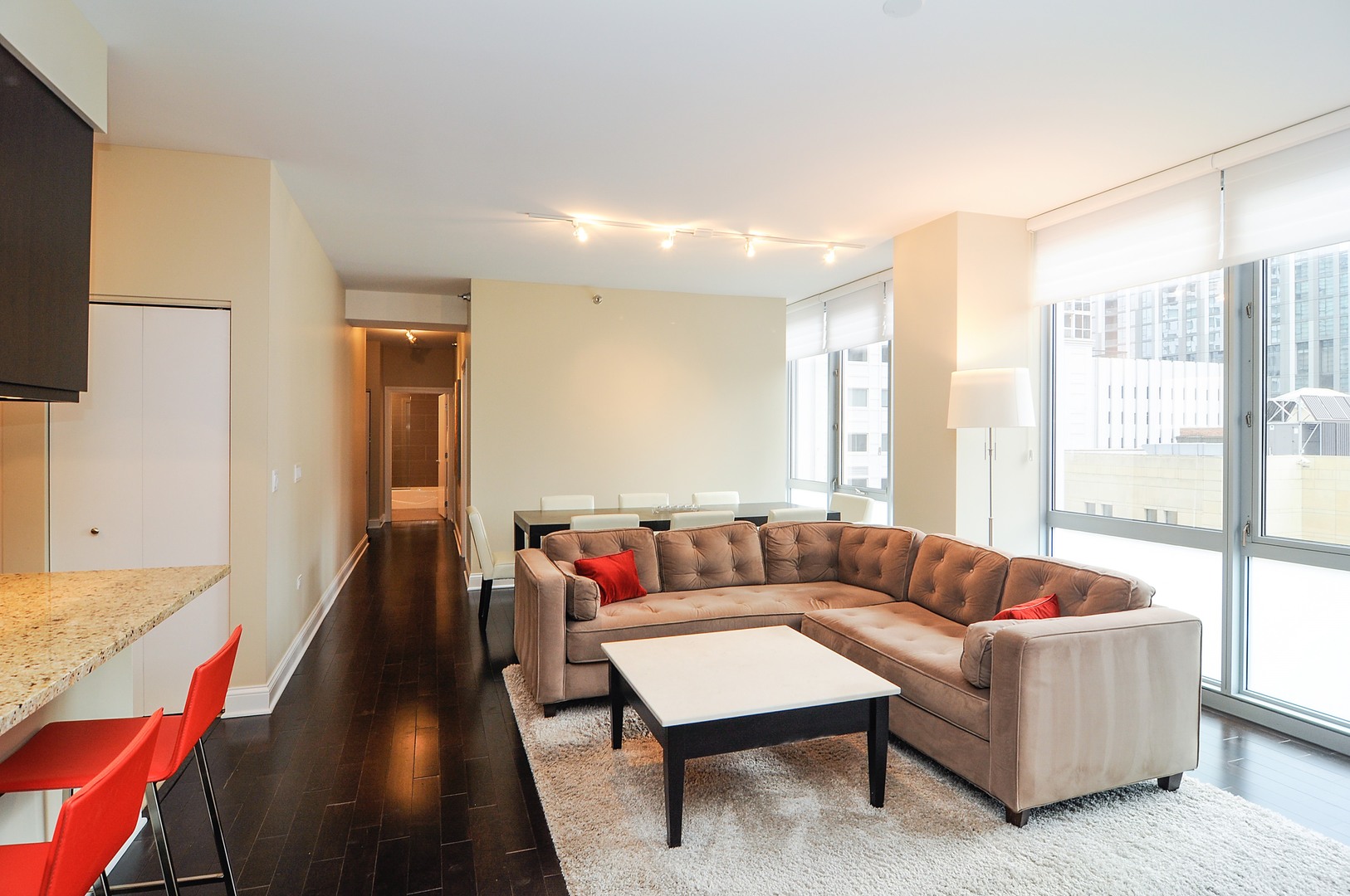 2 West Delaware Place, Unit 504 Chicago, IL 60610 - Photo 4 of 24 a living room with furniture and a large window