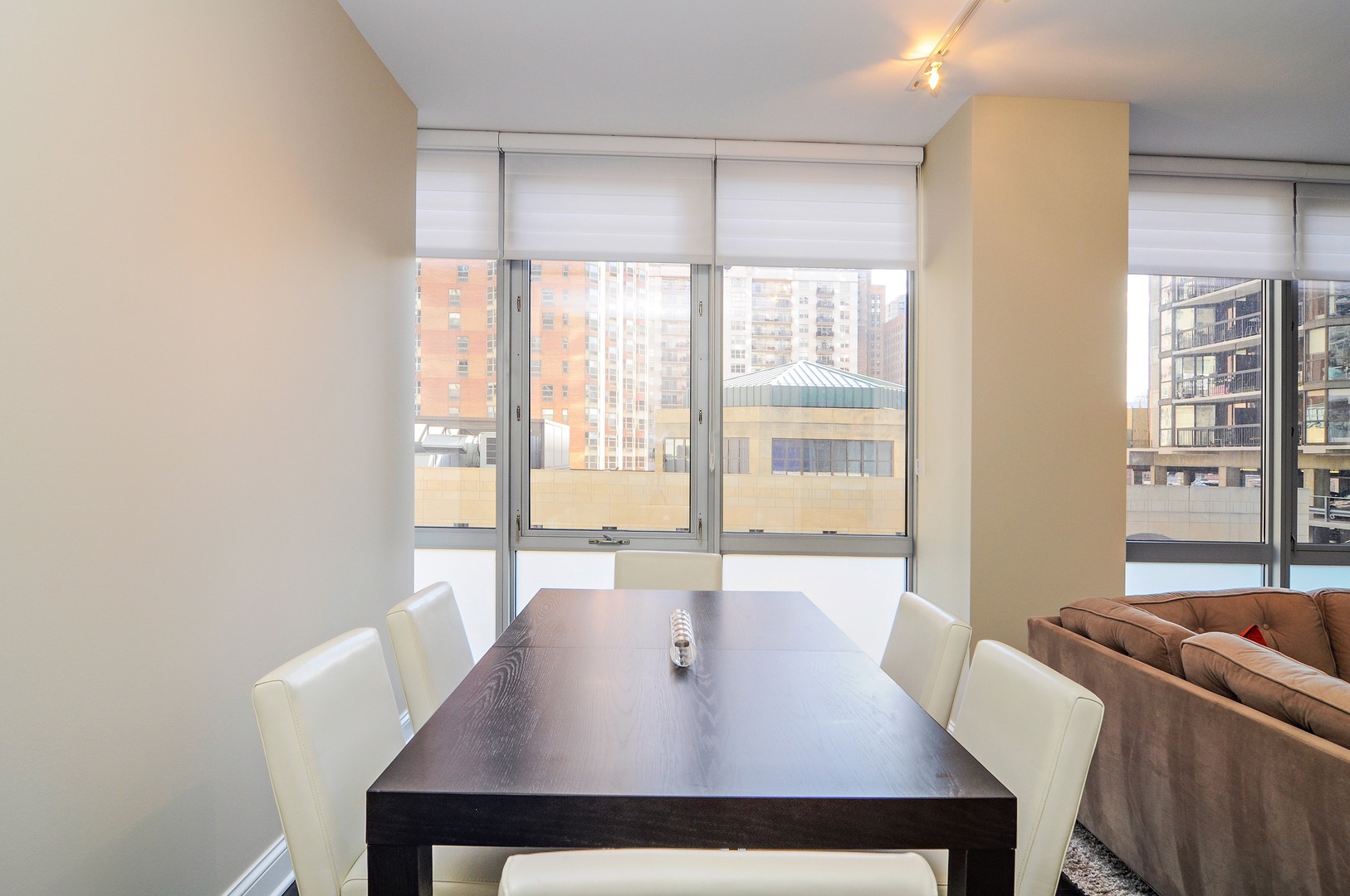 2 West Delaware Place, Unit 504 Chicago, IL 60610 - Photo 6 of 24 a view of a dining room with furniture window and outside view