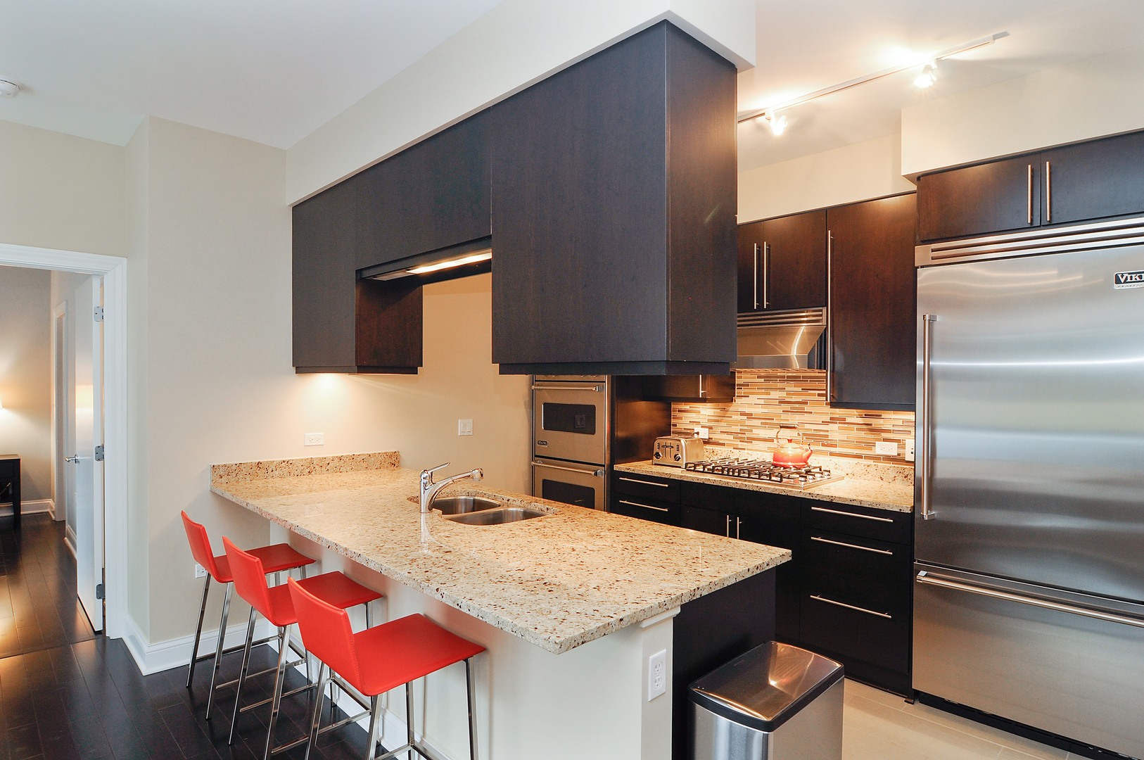 2 West Delaware Place, Unit 504 Chicago, IL 60610 - Photo 7 of 24 a kitchen with a table and chairs