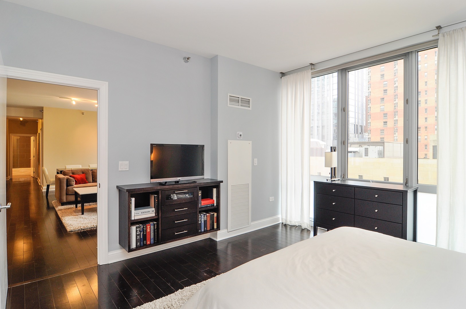 2 West Delaware Place, Unit 504 Chicago, IL 60610 - Photo 8 of 24 a room with furniture and flat screen tv