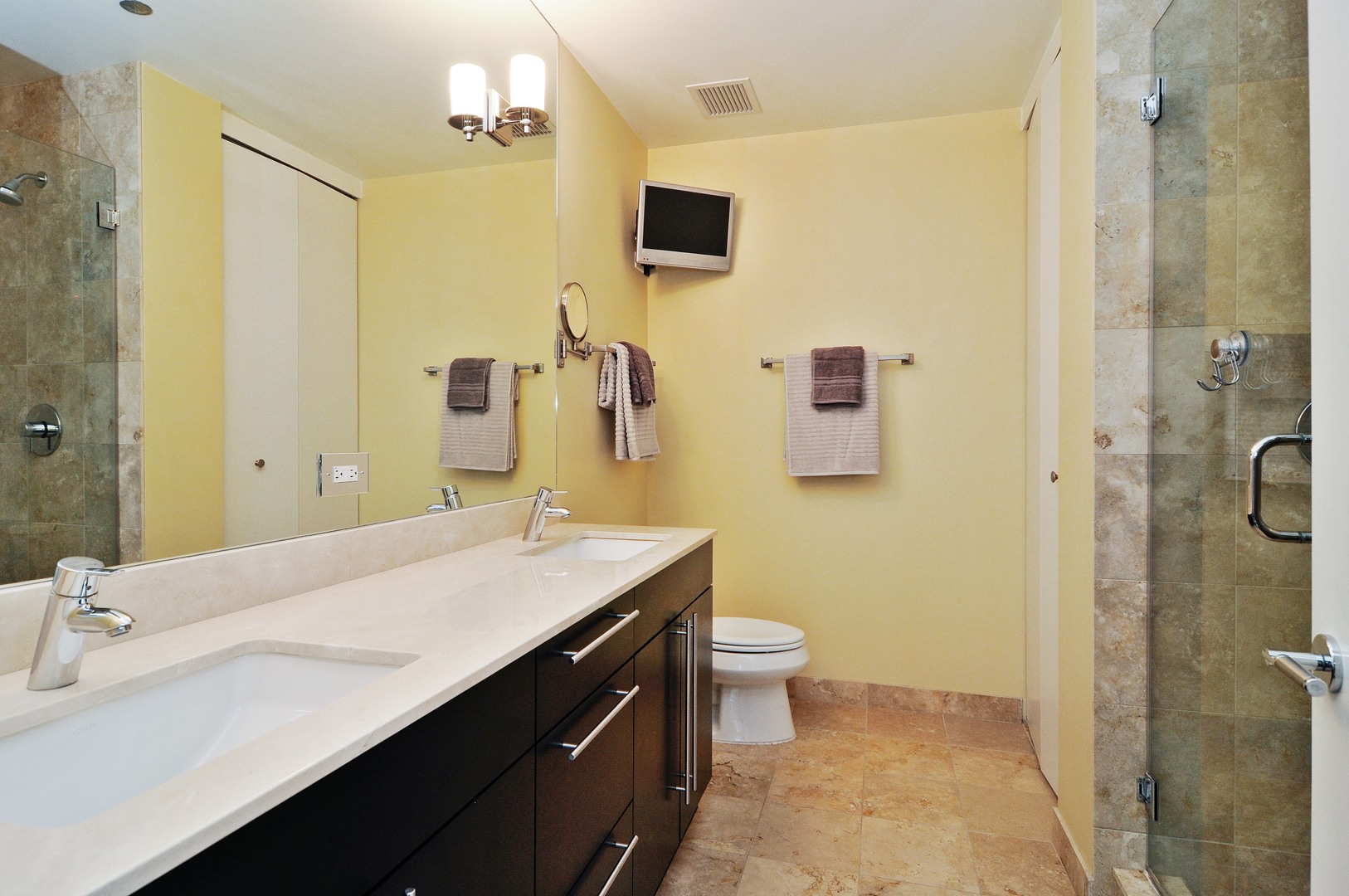 2 West Delaware Place, Unit 504 Chicago, IL 60610 - Photo 9 of 24 a bathroom with a sink a toilet and shower