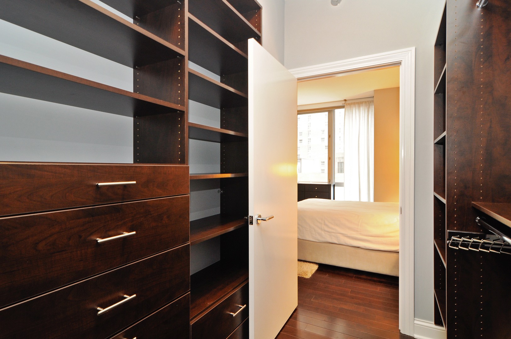 2 West Delaware Place, Unit 504 Chicago, IL 60610 - Photo 10 of 24 a bedroom with a bed and a window
