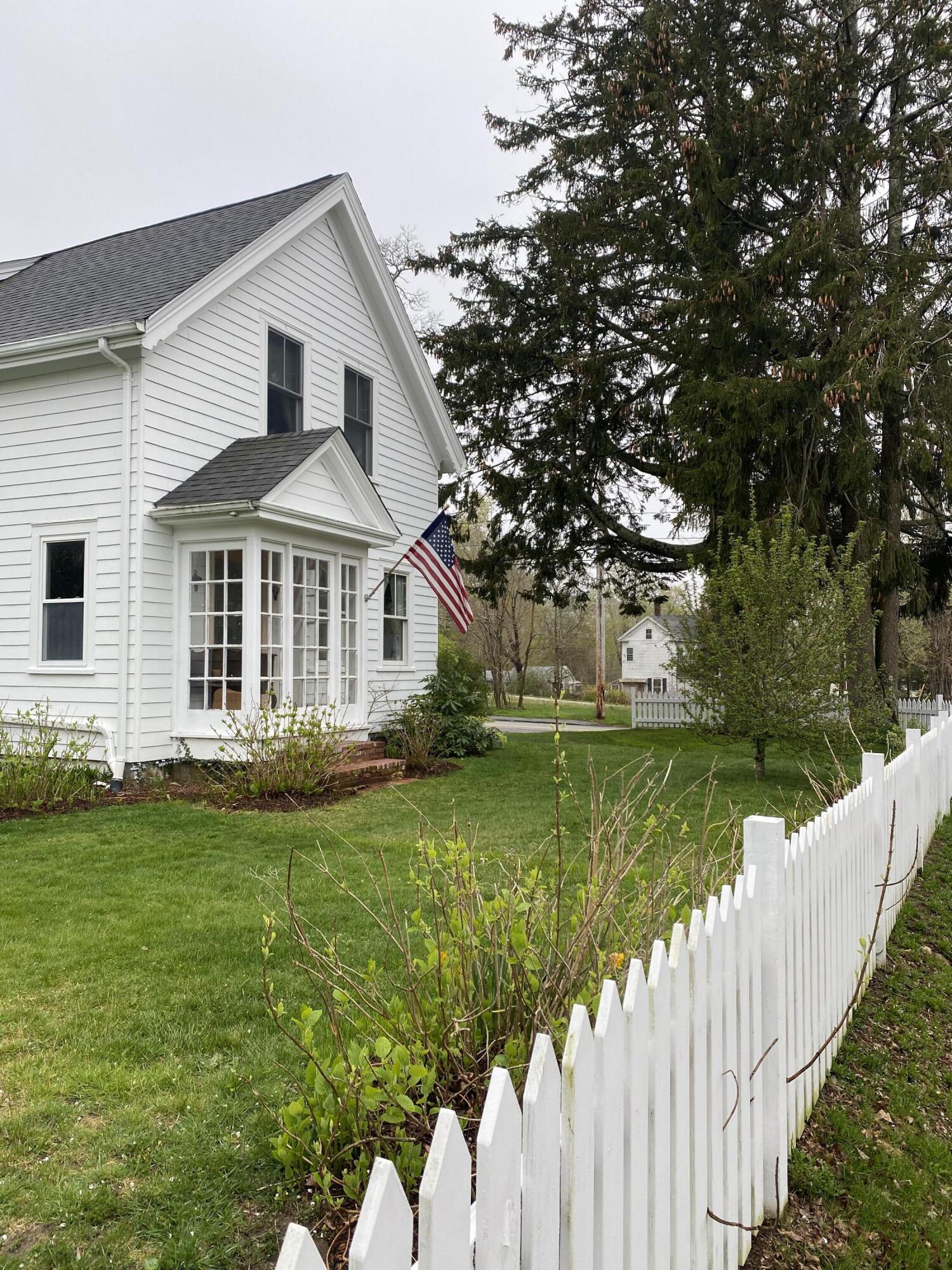 56 Sandwich Road Bourne, MA 02532 - Photo 4 of 31 a front view of a house with garden