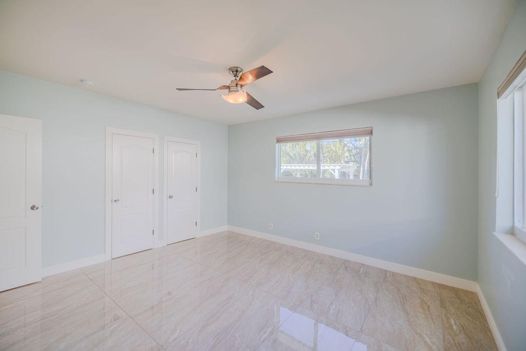 741 Fairway Drive Miami Beach, FL 33141 - Photo 19 of 50 a view of room with a ceiling fan and window