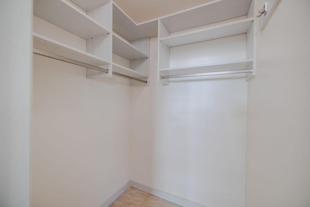 741 Fairway Drive Miami Beach, FL 33141 - Photo 23 of 50 a view of an empty walk in closet