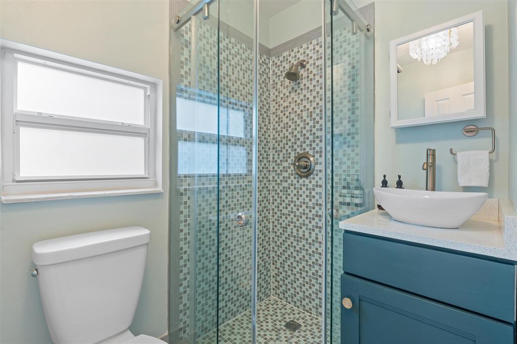 741 Fairway Drive Miami Beach, FL 33141 - Photo 29 of 50 a bathroom with a sink a toilet and shower