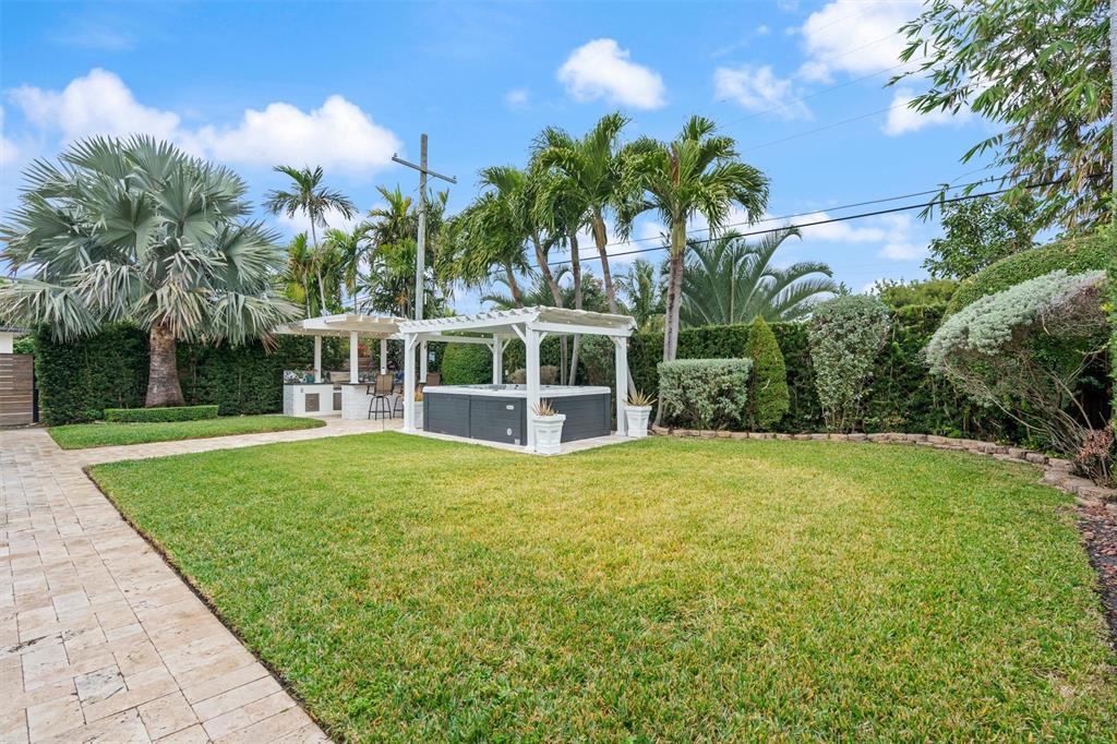 741 Fairway Drive Miami Beach, FL 33141 - Photo 38 of 50 a view of a backyard with a garden