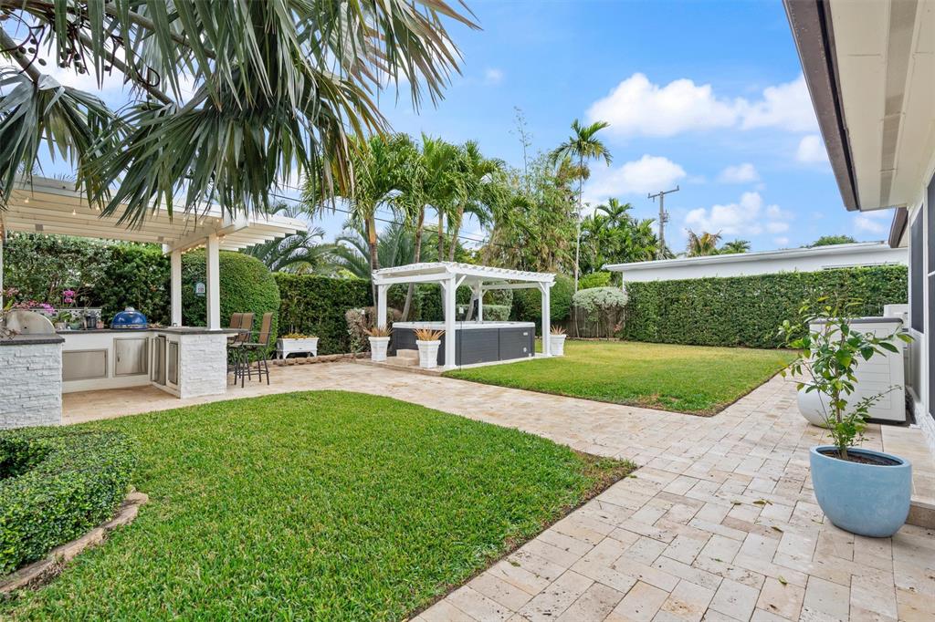 741 Fairway Drive Miami Beach, FL 33141 - Photo 39 of 50 a view of a house with a swimming pool and a porch