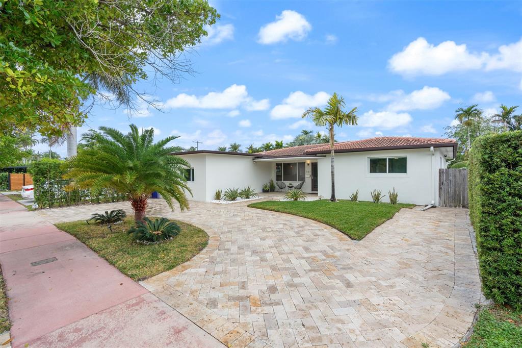 741 Fairway Drive Miami Beach, FL 33141 - Photo 40 of 50 a front view of a house with garden
