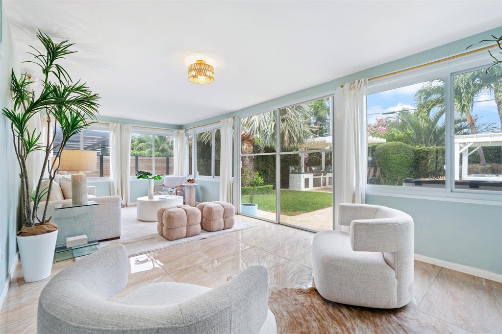 741 Fairway Drive Miami Beach, FL 33141 - Photo 4 of 50 a living room with furniture and a large window