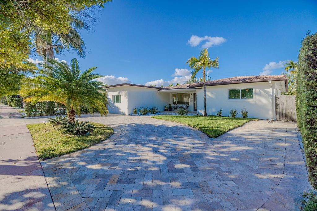 741 Fairway Drive Miami Beach, FL 33141 - Photo 42 of 50 a view of a house with a swimming pool