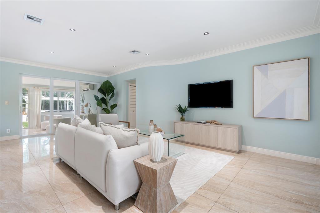 741 Fairway Drive Miami Beach, FL 33141 - Photo 7 of 50 a living room with furniture and a flat screen tv