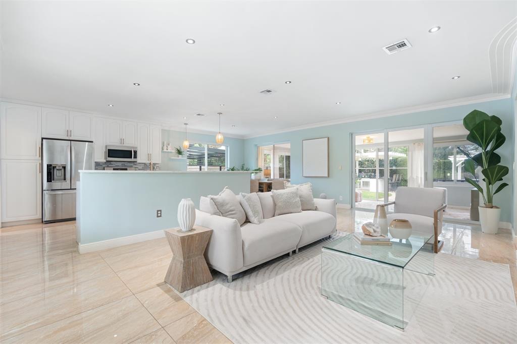 741 Fairway Drive Miami Beach, FL 33141 - Photo 8 of 50 a living room with furniture and a large window