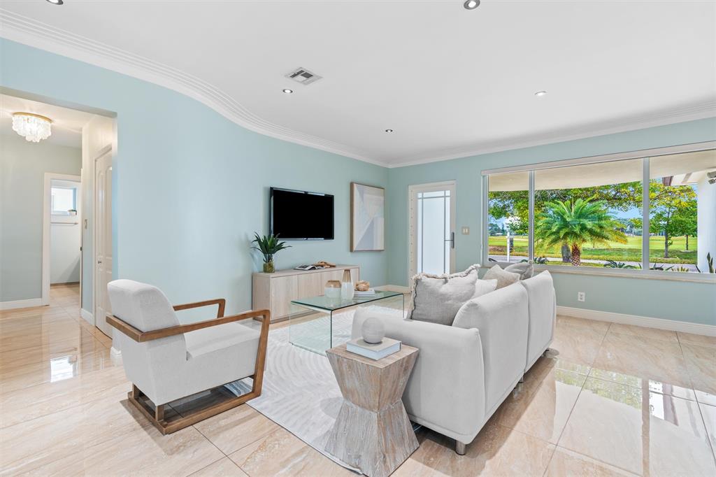 741 Fairway Drive Miami Beach, FL 33141 - Photo 9 of 50 a living room with furniture and a flat screen tv