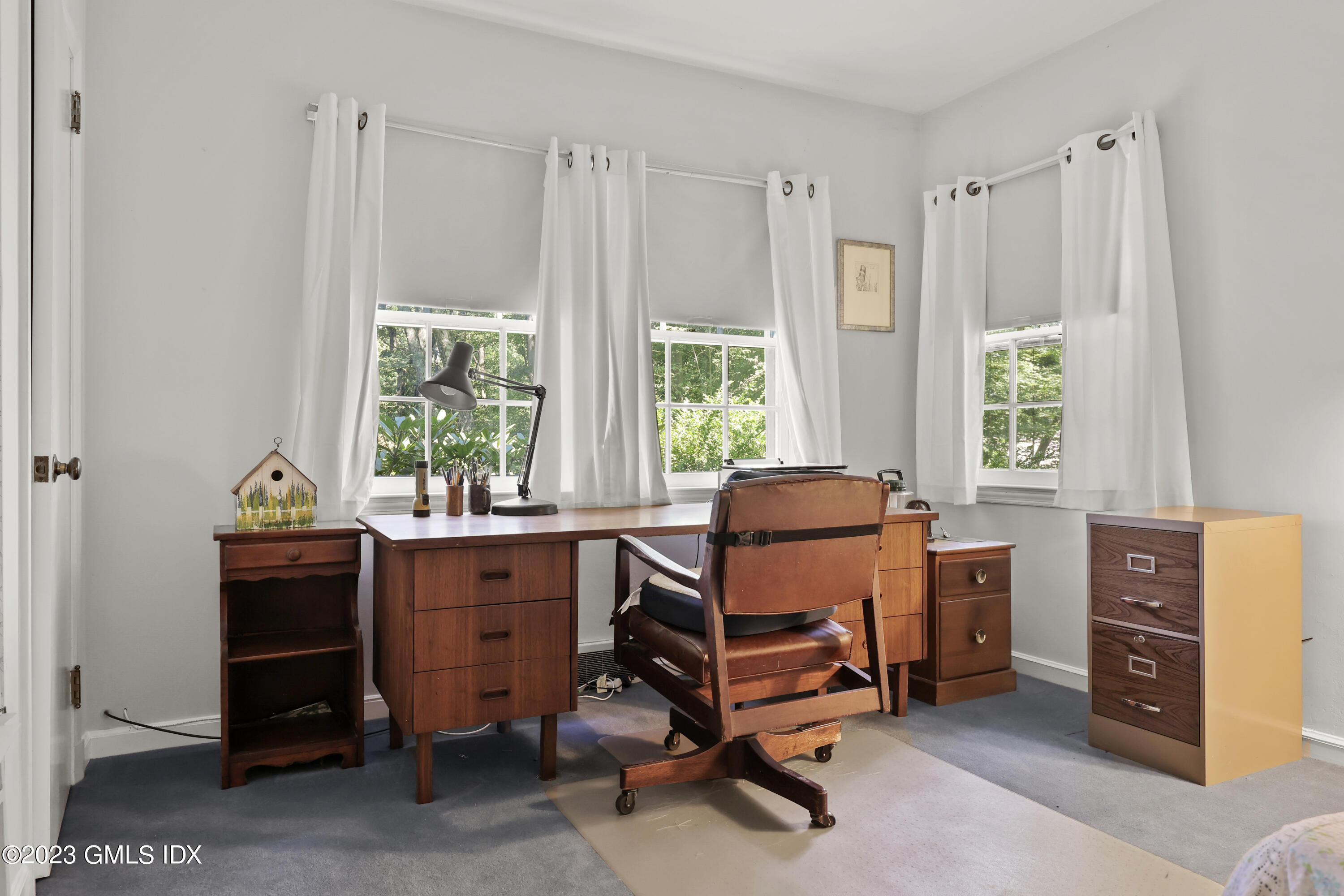 10 Woodchuck Road Stamford, CT 06903 - Photo 19 of 28 a view of a workspace with furniture and a window