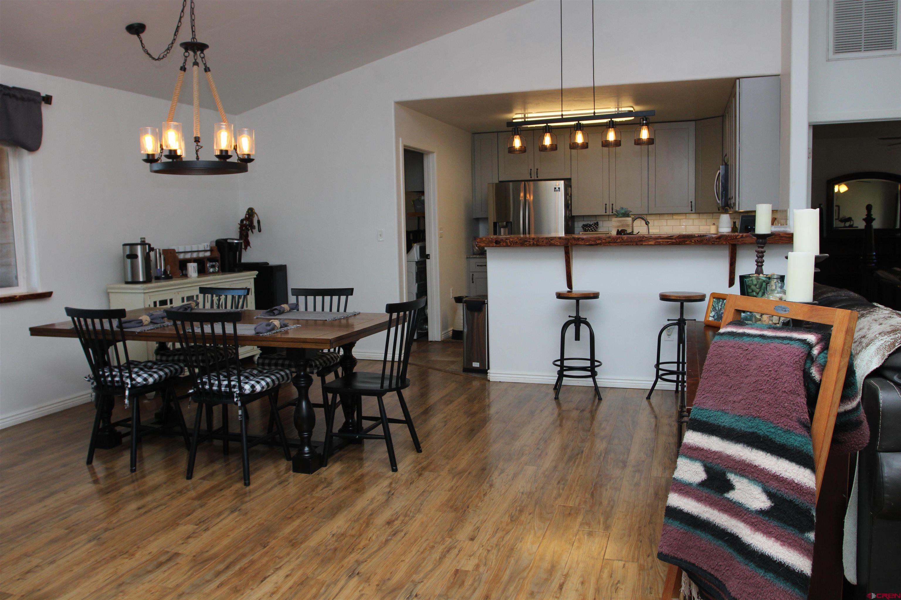 25463 Vail Road Cedaredge, CO 81413 - Photo 12 of 28 a view of a dining room with furniture and chandelier