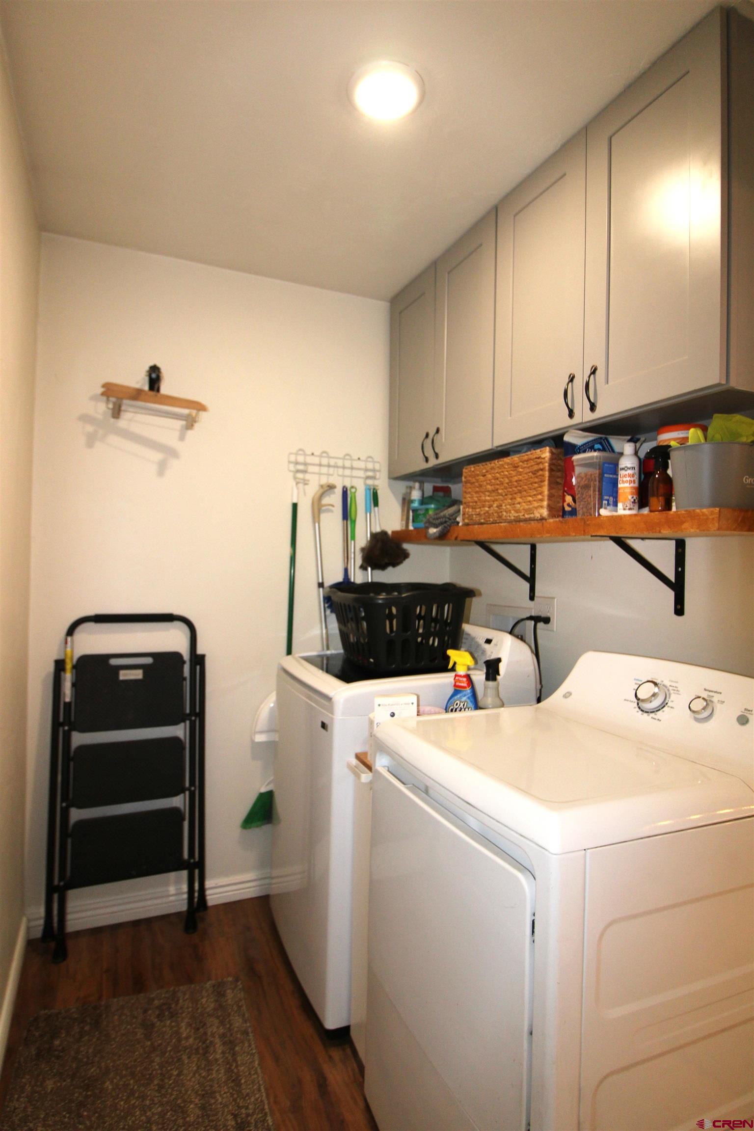 25463 Vail Road Cedaredge, CO 81413 - Photo 19 of 28 a view of storage and utility room with washer and dryer