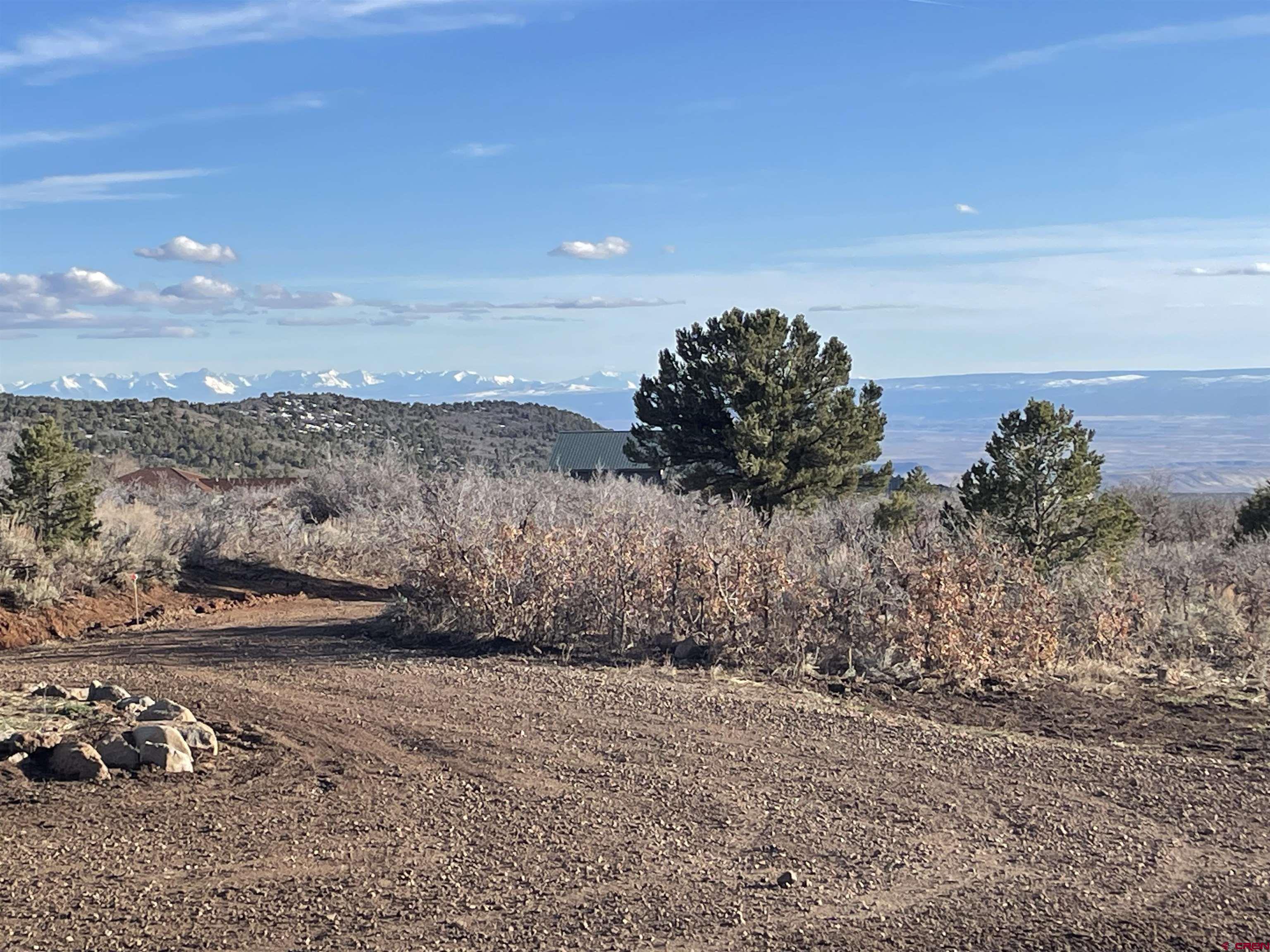 25463 Vail Road Cedaredge, CO 81413 - Photo 2 of 28 a view of a road with an ocean view