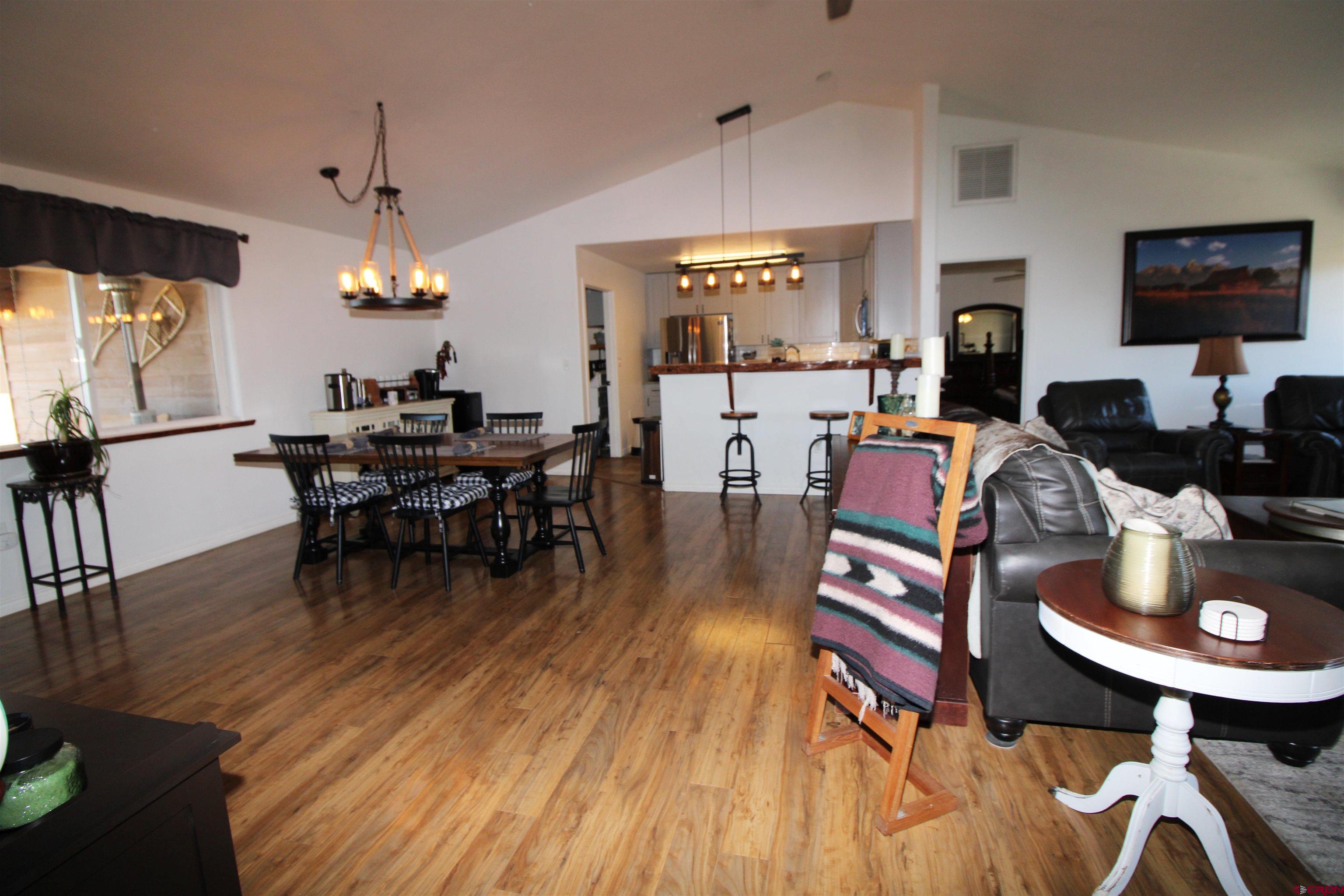 25463 Vail Road Cedaredge, CO 81413 - Photo 10 of 28 a living room with furniture and a wooden floor