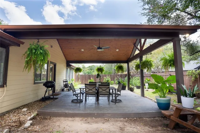 a dining room with furniture and a garden