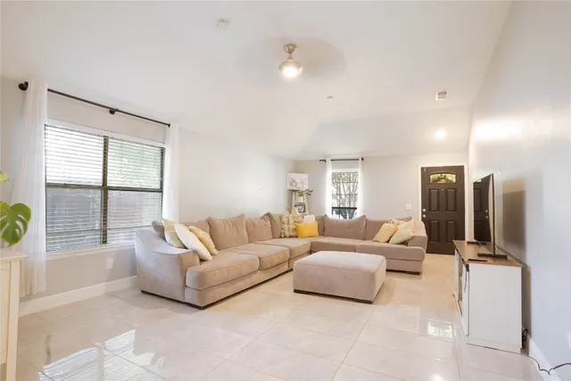 a living room with furniture and a large window