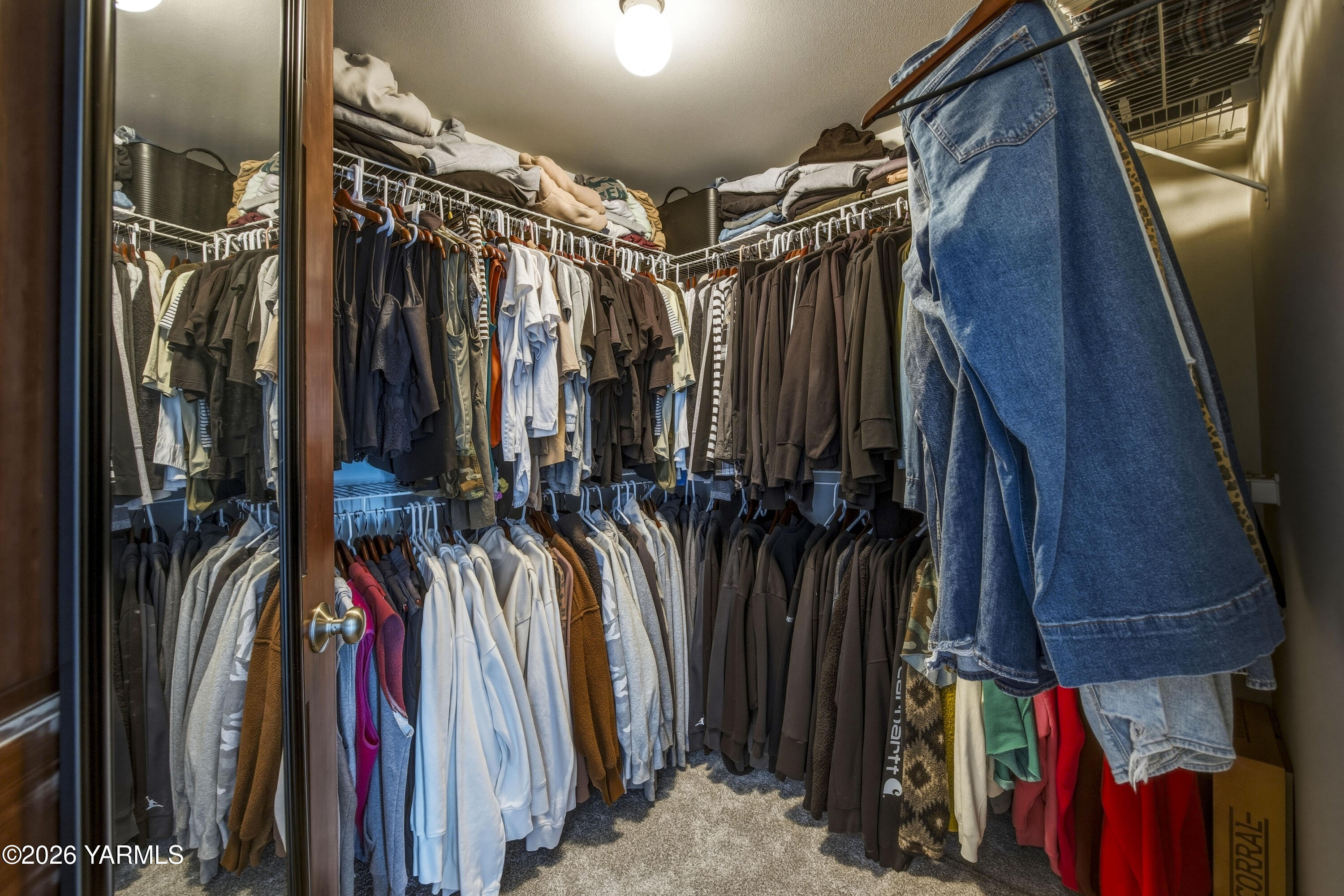 2050 Olmstead Road Grandview, WA 98930 - Photo 42 of 60 a view of walk in closet with clothes