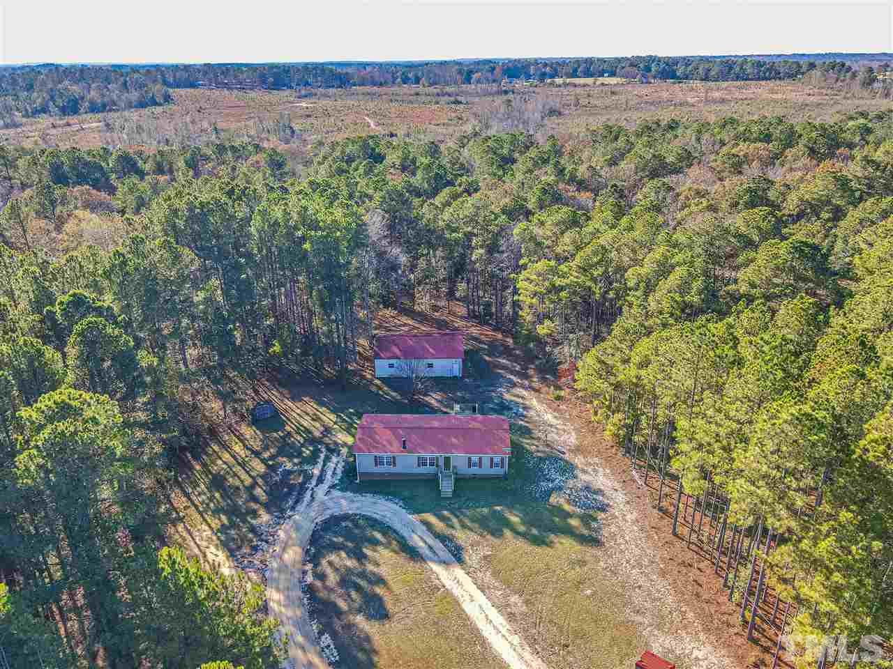 72 Cypress Farm Road Cameron, NC 28326 - Photo 1 of 28 an aerial view of a house with a yard