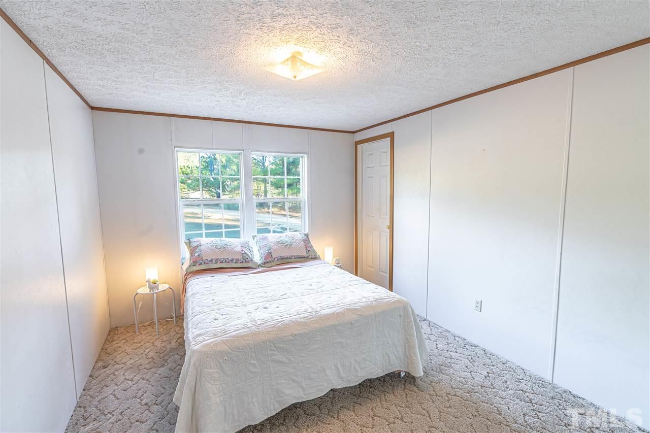 72 Cypress Farm Road Cameron, NC 28326 - Photo 11 of 28 a bedroom with a bed and a window