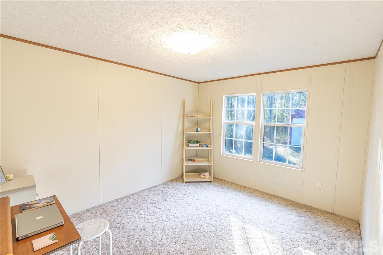 72 Cypress Farm Road Cameron, NC 28326 - Photo 12 of 28 an empty room with windows