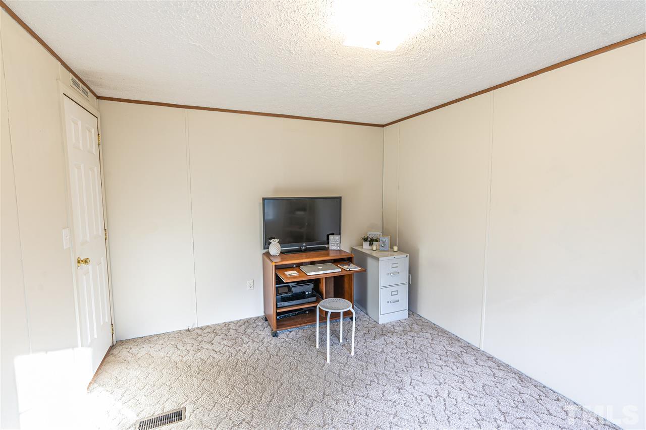72 Cypress Farm Road Cameron, NC 28326 - Photo 13 of 28 a workspace with furniture and a table