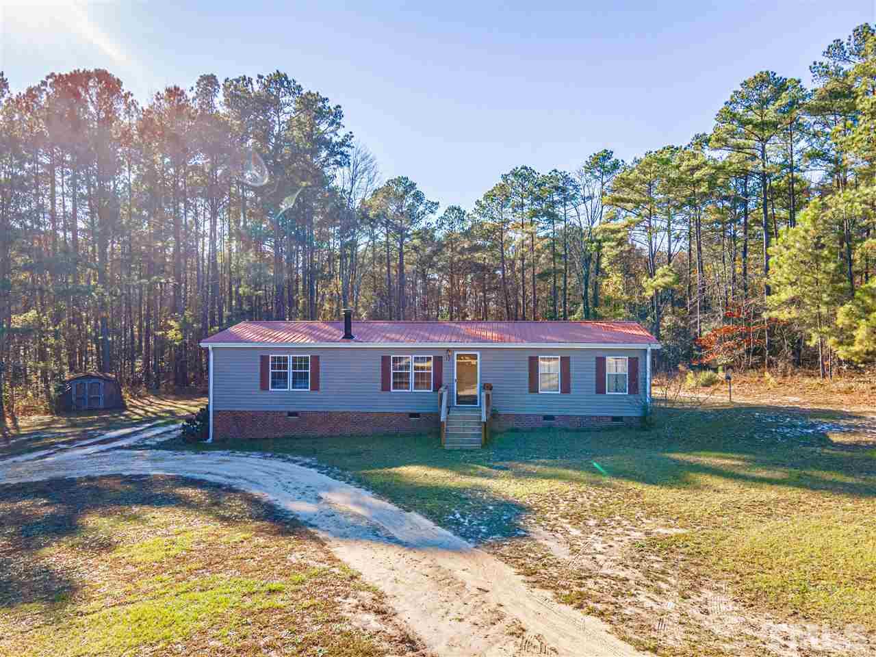 72 Cypress Farm Road Cameron, NC 28326 - Photo 3 of 28 a view of a house with swimming pool and a yard