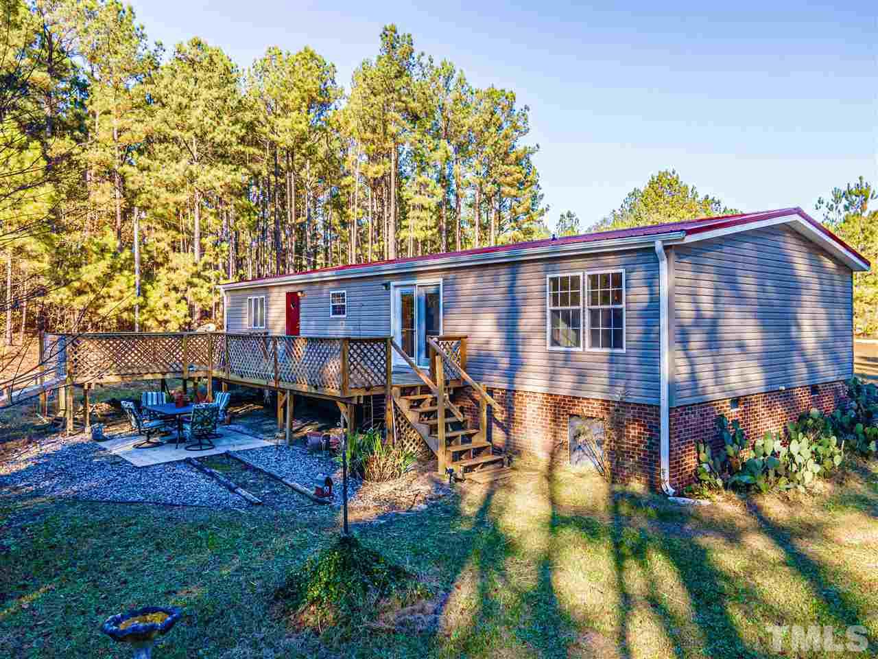 72 Cypress Farm Road Cameron, NC 28326 - Photo 23 of 28 a view of a house with backyard and sitting area