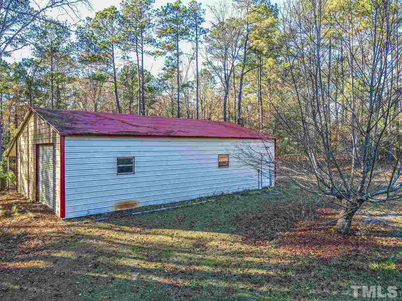 72 Cypress Farm Road Cameron, NC 28326 - Photo 24 of 28 a view of a backyard with a barn