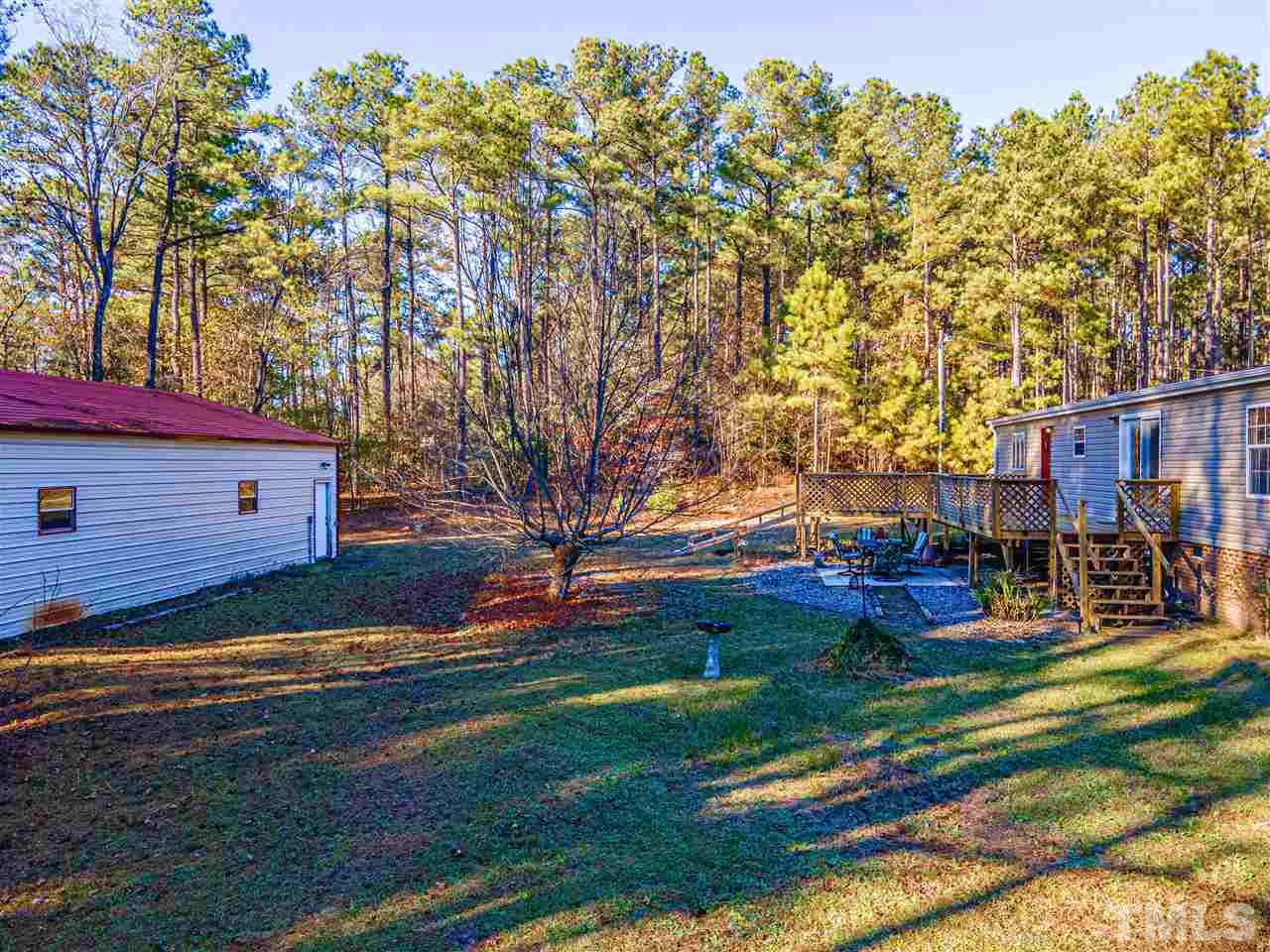 72 Cypress Farm Road Cameron, NC 28326 - Photo 26 of 28 a view of backyard with outdoor seating and green space