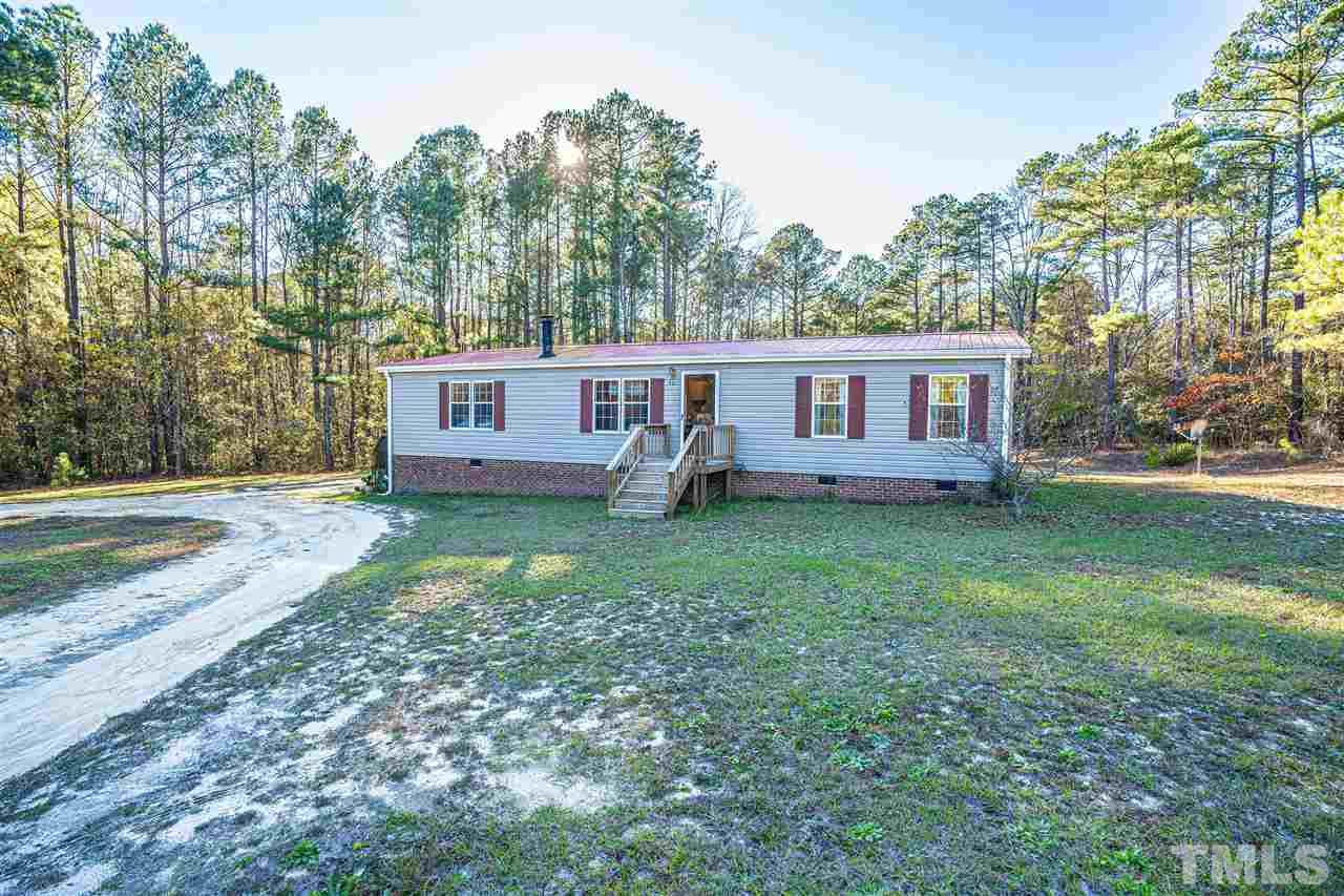 72 Cypress Farm Road Cameron, NC 28326 - Photo 27 of 28 a view of a house with backyard and sitting area