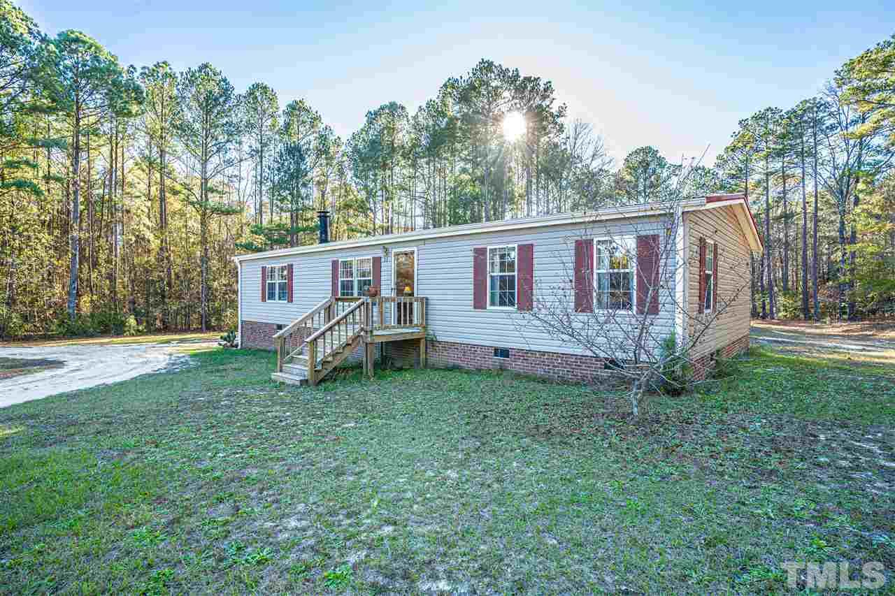 72 Cypress Farm Road Cameron, NC 28326 - Photo 28 of 28 a view of a house with a backyard and a patio