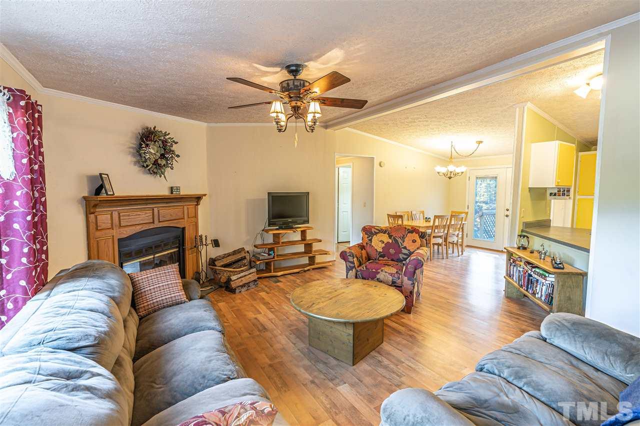 72 Cypress Farm Road Cameron, NC 28326 - Photo 4 of 28 a living room with furniture fireplace and a large window