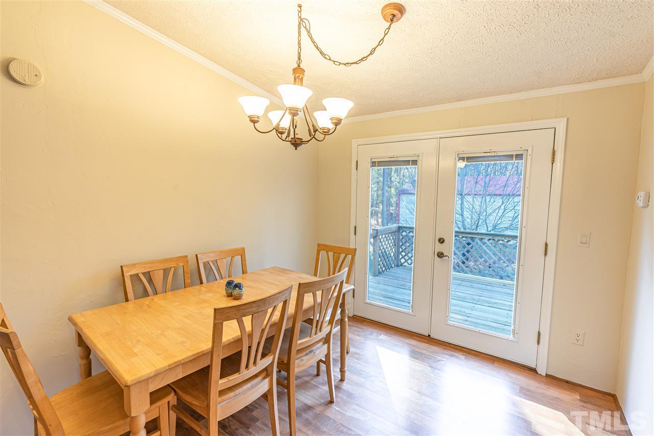 72 Cypress Farm Road Cameron, NC 28326 - Photo 6 of 28 a view of a dining room with furniture wooden floor and chandelier