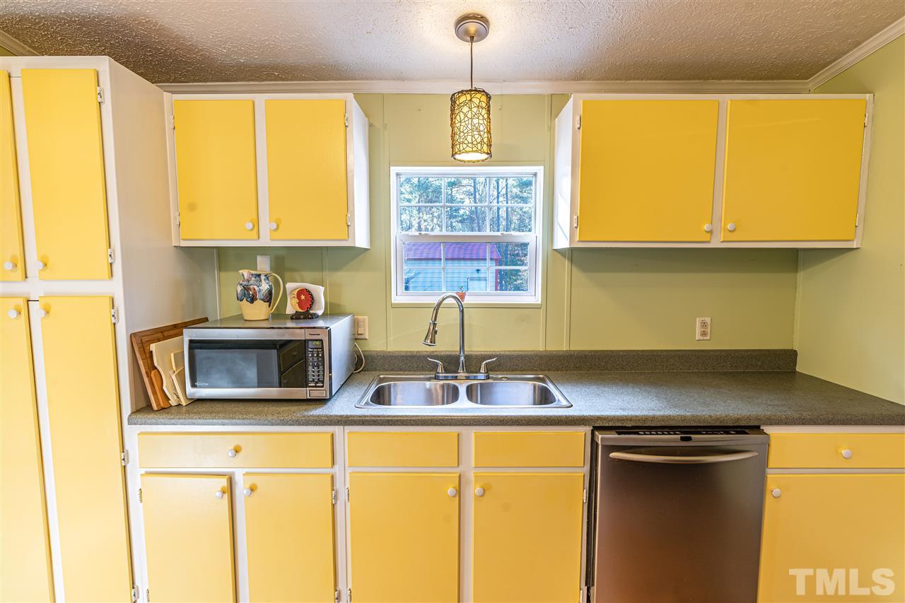 72 Cypress Farm Road Cameron, NC 28326 - Photo 9 of 28 a kitchen with stainless steel appliances granite countertop a sink and a window