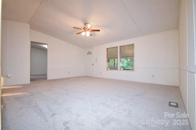 a kitchen with stainless steel appliances granite countertop lots of counter top space and wooden floor