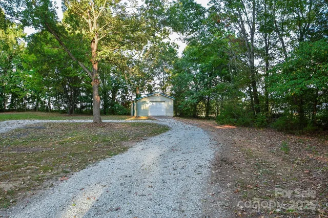 a view of a yard with a tree
