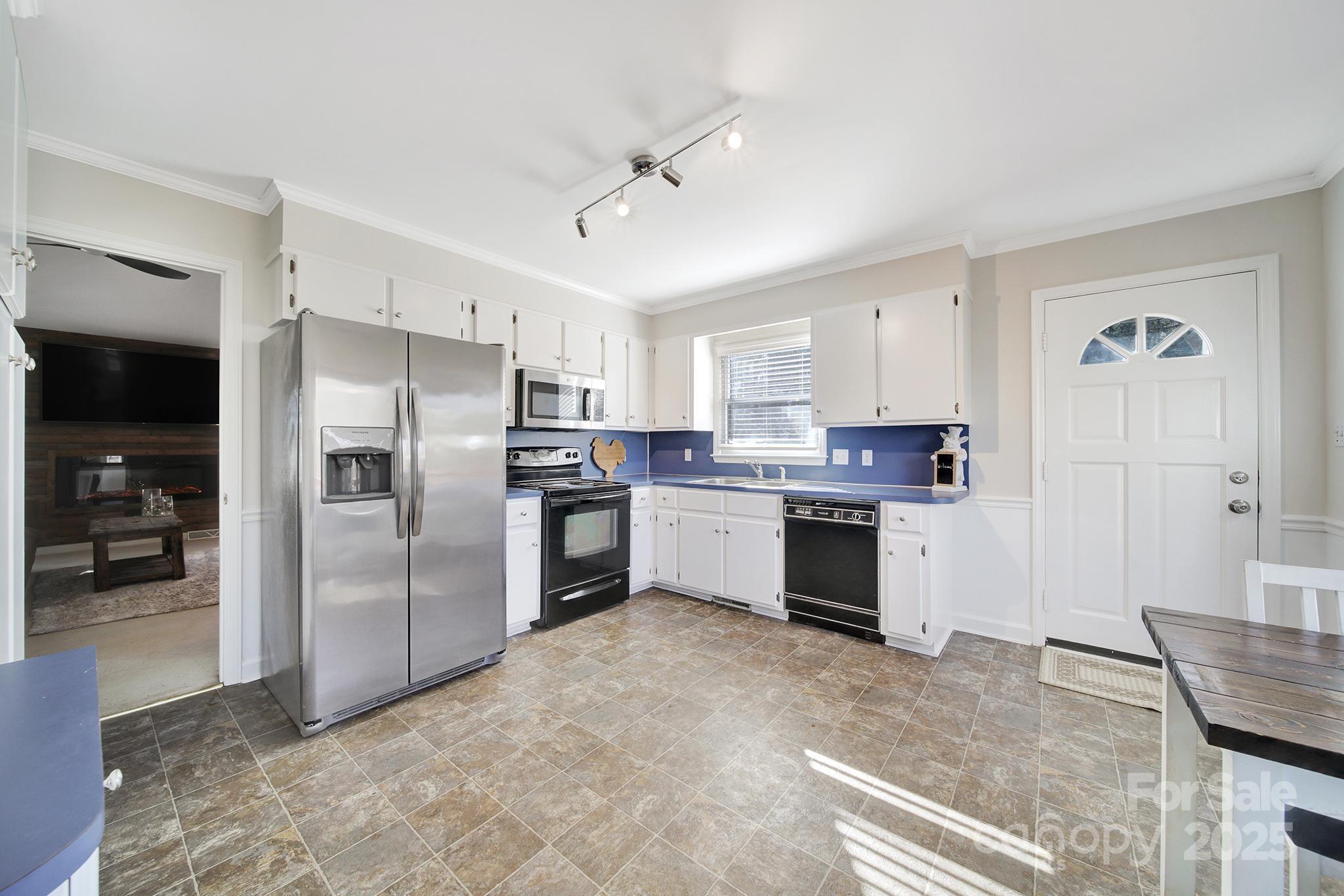 4289 Falcon Hall Way Rock Hill, SC 29730 - Photo 9 of 22 a kitchen with granite countertop a refrigerator oven a sink and dishwasher