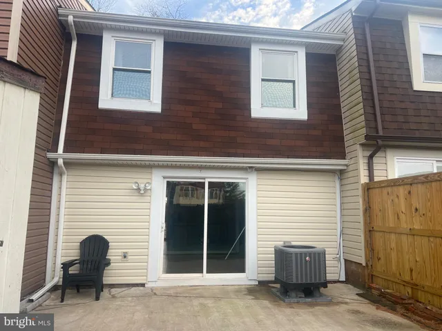 a couple of chairs in front of house