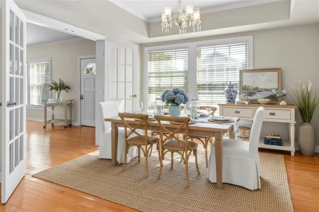 a view of a dining room with furniture window and wooden floor