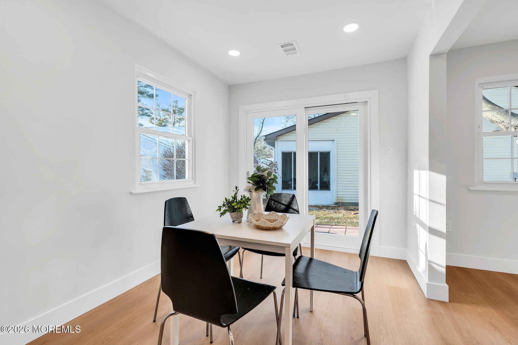 5 Jaffreyton Close Freehold, NJ 07728 - Photo 13 of 22 a dining room with furniture and wooden floor