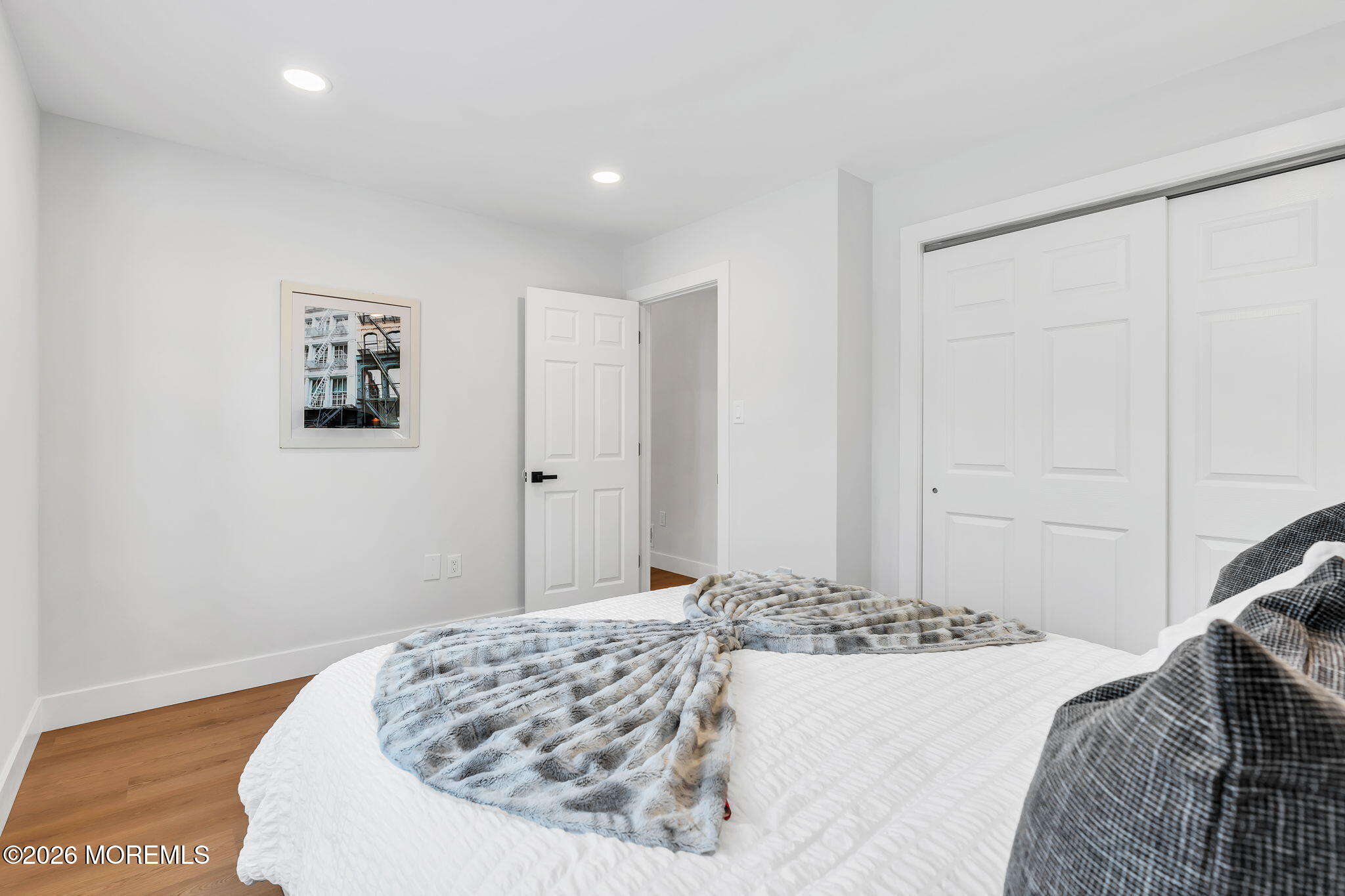 5 Jaffreyton Close Freehold, NJ 07728 - Photo 15 of 22 a bedroom with a bed and a painting on the wall